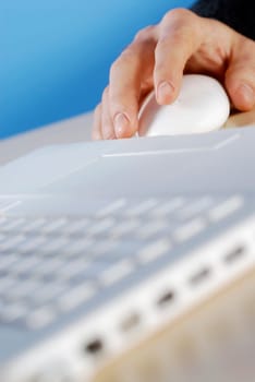 Close-up of a personŽs hand using a computer mouse