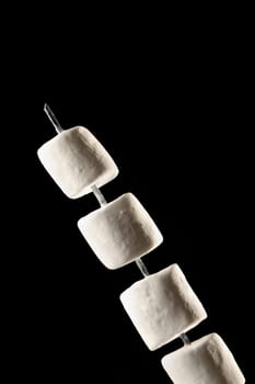 Close-up of marshmallows on a skewer