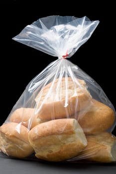 Close-up of bread buns in a plastic bag