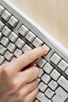 Close-up of a personŽs hand using a computer keyboard