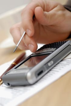 Close-up of a personŽs hand operating a mobile phone