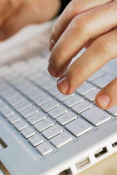 Close-up of a personŽs hand using a laptop