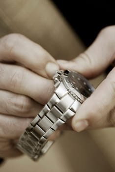 Close-up of a personŽs hand holding a wristwatch
