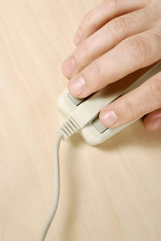 Close-up of a personŽs hand using a computer mouse