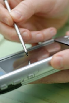 Close-up of a personŽs hand operating a mobile phone