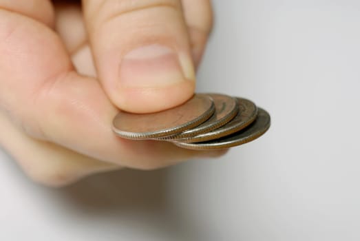 Close-up of a personŽs hand holding four coins