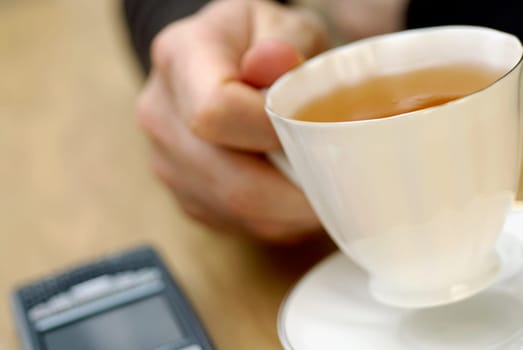Close-up of a personŽs hand holding a cup of tea