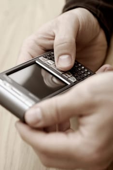 Close-up of a personŽs hand operating a mobile phone