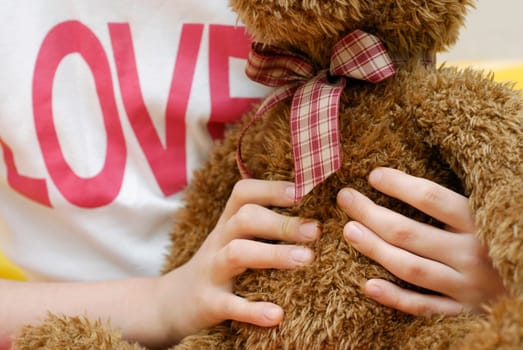 Close-up of a personŽs hand holding a teddy bear