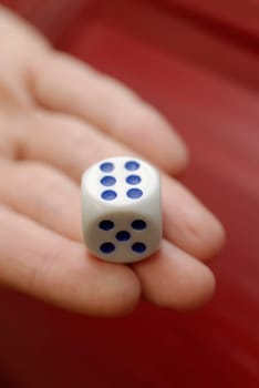 Close-up of a personŽs hand holding a dice