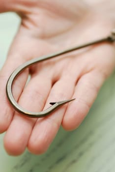 Close-up of a hook on a human palm