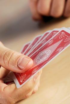 Close-up of a personŽs hand holding playing cards