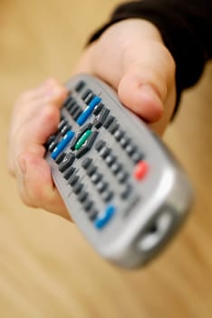 Close-up of a personŽs hand holding a remote control