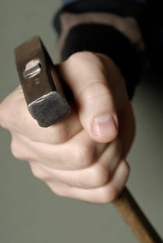 Close-up of a personŽs hand holding a hammer