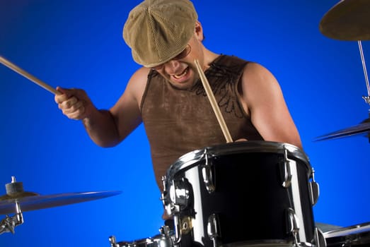 Male drummer playing drums