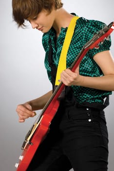 Close-up of a guitarist playing a guitar