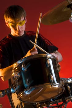 Male drummer playing drums