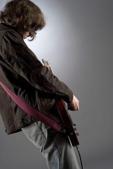 Close-up of a guitarist playing a guitar