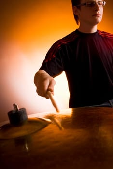 Male drummer playing drums