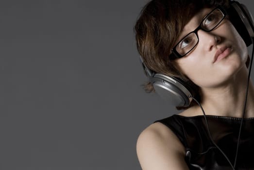 Close-up of a young woman listening to music