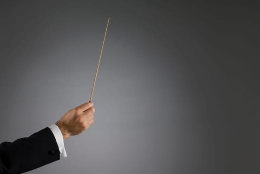 Close-up of a conductorŽs hand holding a conductorŽs baton