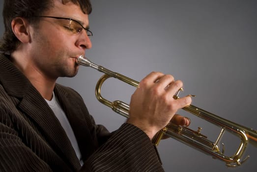 Close-up of a male musician playing a trumpet
