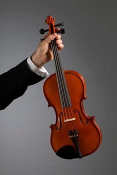 Close-up of a musicianŽs hand holding a violin