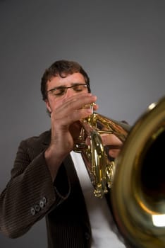 Male musician playing a trumpet