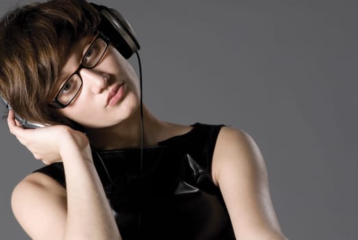 Close-up of a young woman listening to music