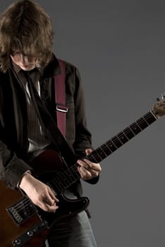 Close-up of a guitarist playing a guitar