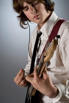 Close-up of a guitarist playing a guitar