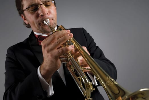 Close-up of a male musician playing a trumpet