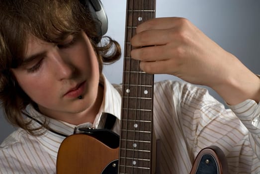 Close-up of a guitarist playing a guitar