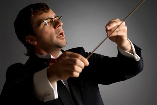 Close-up of a music conductor performing