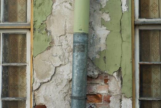 Close-up of a pipe mounted on a wall
