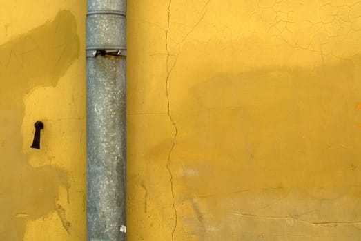 Close-up of a pipe mounted on a wall