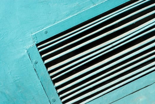 Close-up of an air duct on a wall