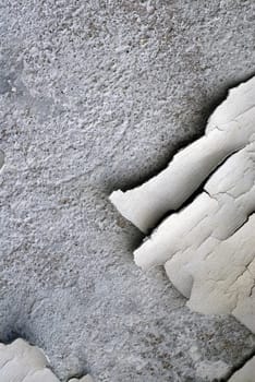 Close-up of plaster peeling from a wall
