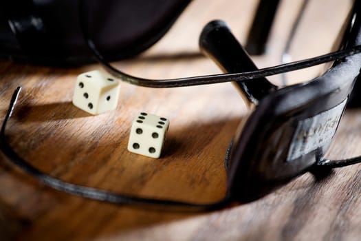 Close-up of high heel shoes with two dice