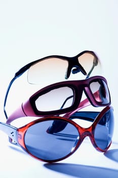 Close-up of three pairs of sunglasses