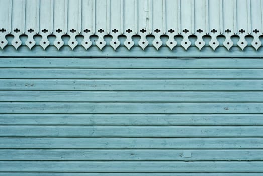 Close-up of a decorated roof on a wooden wall