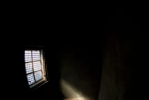 Sunlight entering a dark room through a window
