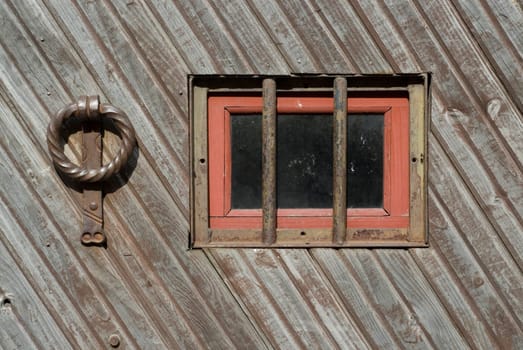 Close-up of a doorknocker with a window