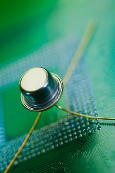 Close_up of a transistor on a mother board