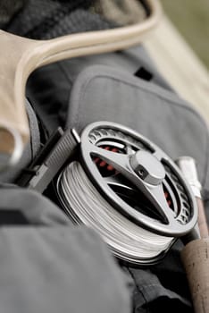 Close-up of a fishing reel and a fishing rod