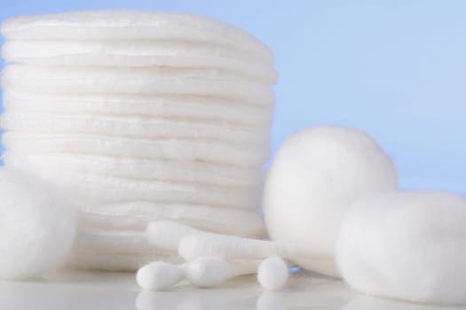 Close-up of cotton swabs with cotton balls
