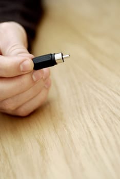 Close-up of a personŽs hand holding an electrical plug