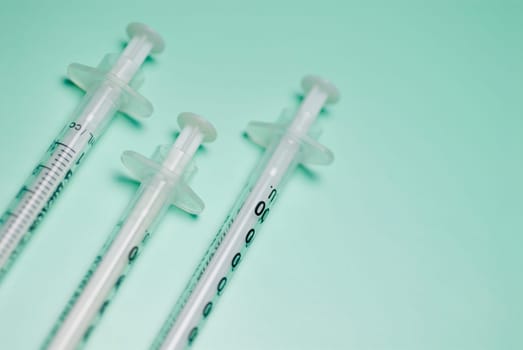 Close_up of three syringes