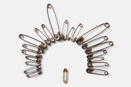 Close-up of safety pins arranged in a circle