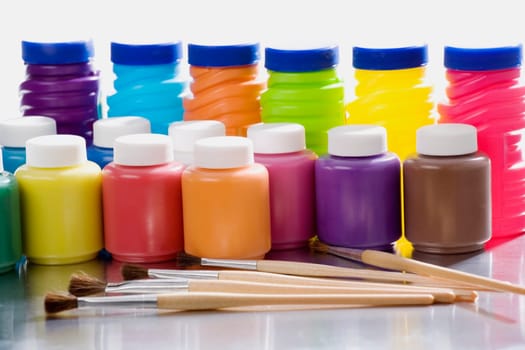Close-up of brushes with watercolor paints